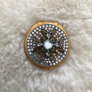 Genuine crystals compact mirror. Never used.